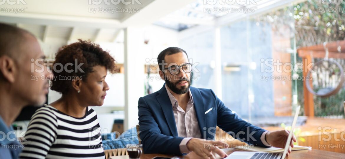 Couple talking to finance advisor at home